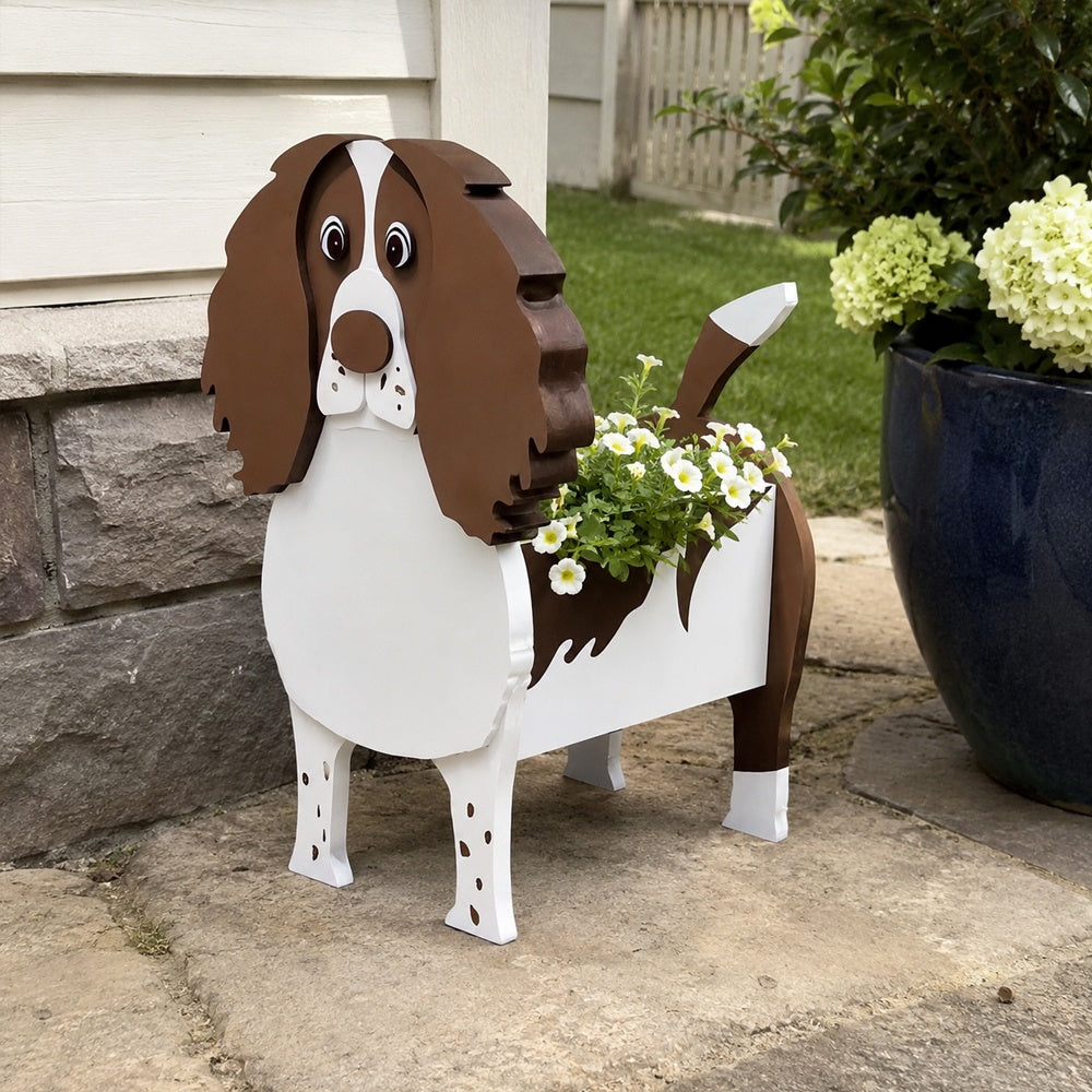 English Springer Spaniel dog planter filled with fresh flowers is placed in the garden