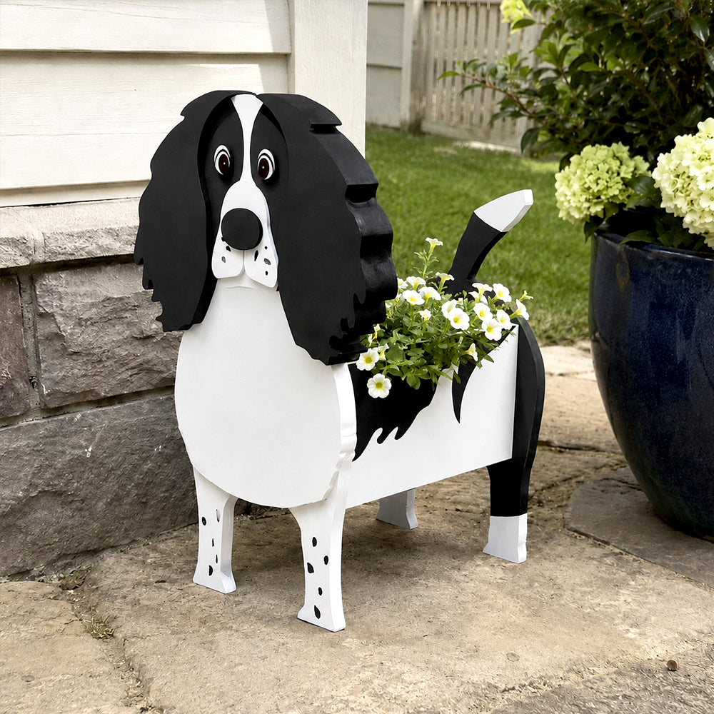 English Springer Spaniel dog planter filled with fresh flowers is placed in the garden