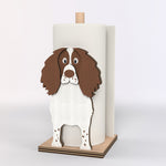 English Springer Spaniel Wooden Dog Paper Towel Holder displayed on a kitchen countertop with a freestanding paper towel roll