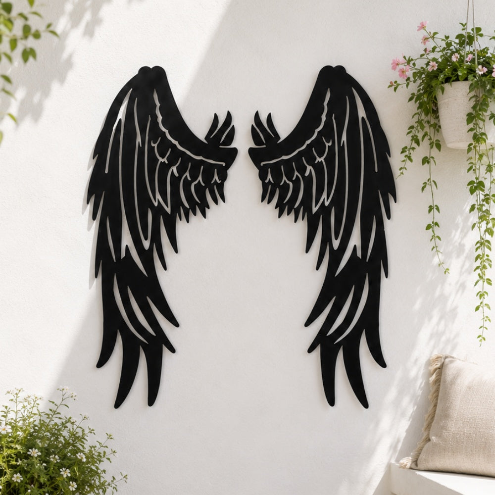Black metal Fallen Angel wings wall art with intricate cutout details displayed on the wall