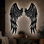 Black metal Fallen Angel wings wall art with Soft White LED Lighting displayed on the wall