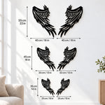 Black metal Fallen Angel wings wall art with intricate cutout details displayed on the wall