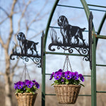 Field spaniel metal hanging basket bracket mounted on outdoor wall for plant decoration