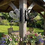 Floral heart metal hanging basket bracket mounted on outdoor wall for plant decoration