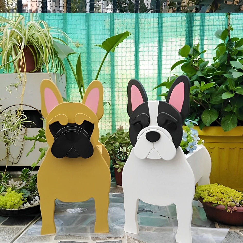 French Bulldog planters filled with fresh flowers are placed in the garden.