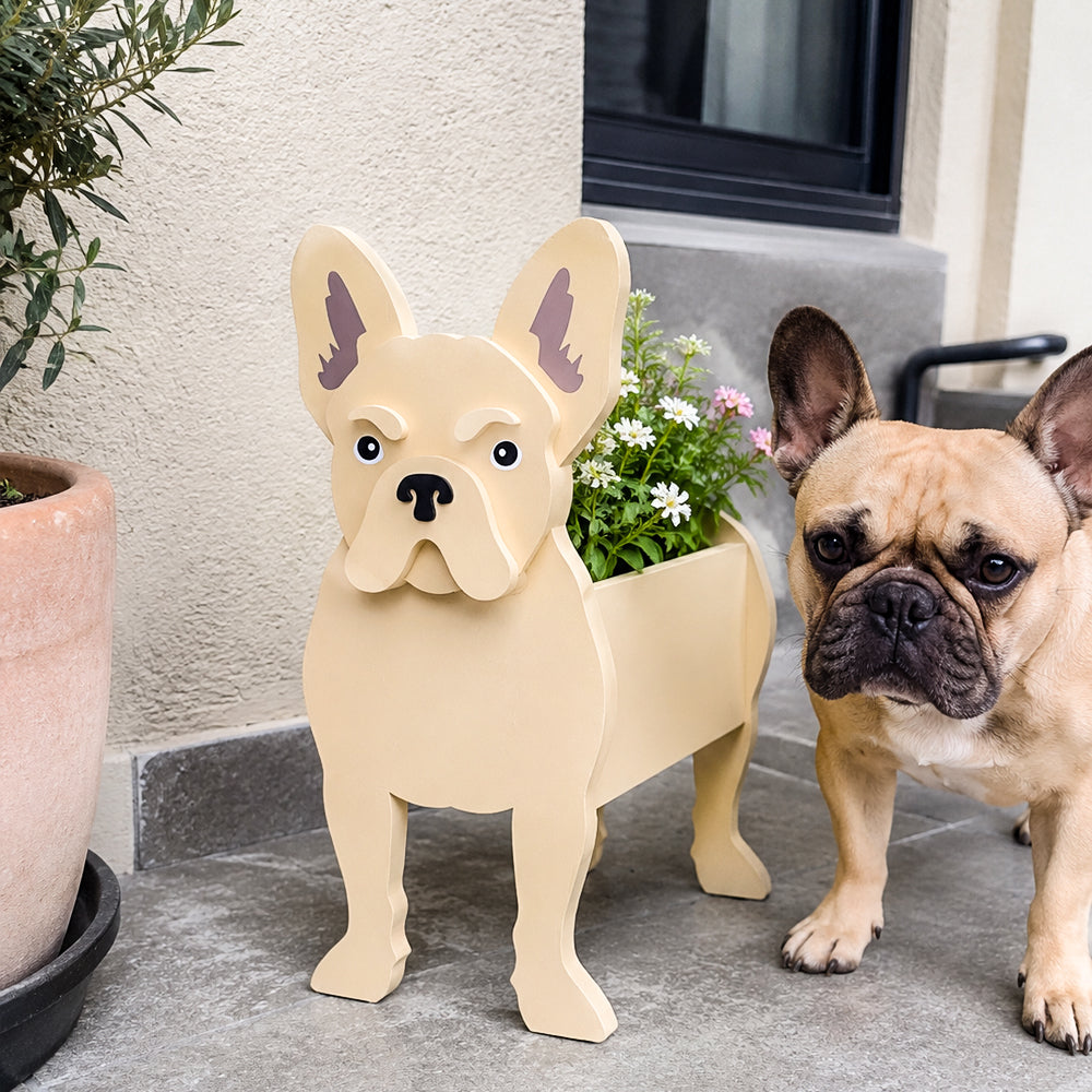 French Bulldog planter filled with fresh flowers is placed in the garden.