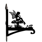 Garden fairy sitting on mushroom metal hanging basket bracket mounted on outdoor wall for plant decoration