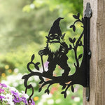 Garden gnome metal hanging basket bracket mounted on outdoor wall for plant decoration