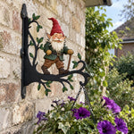 Garden gnome metal hanging basket bracket mounted on outdoor wall for plant decoration