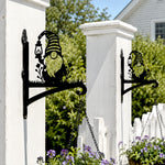 Garden gnome metal hanging basket bracket mounted on outdoor wall for plant decoration