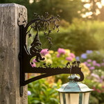 Garden gnome under tree metal hanging basket bracket mounted on outdoor wall for plant decoration