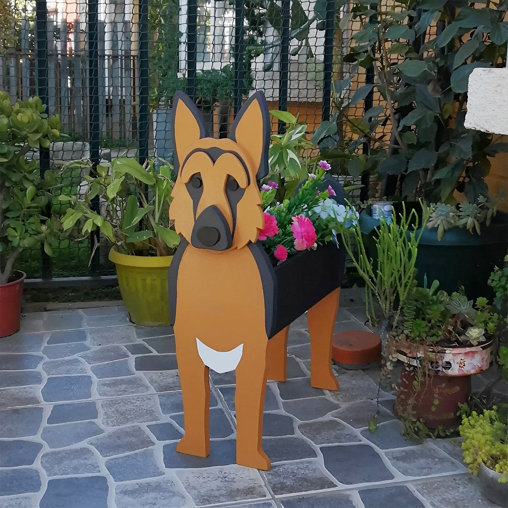 German Shepherd dog planter filled with fresh flowers is placed in the garden.