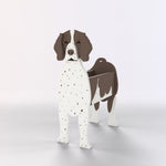 German Shorthaired Pointer dog planter filled with fresh flowers is placed in the garden.