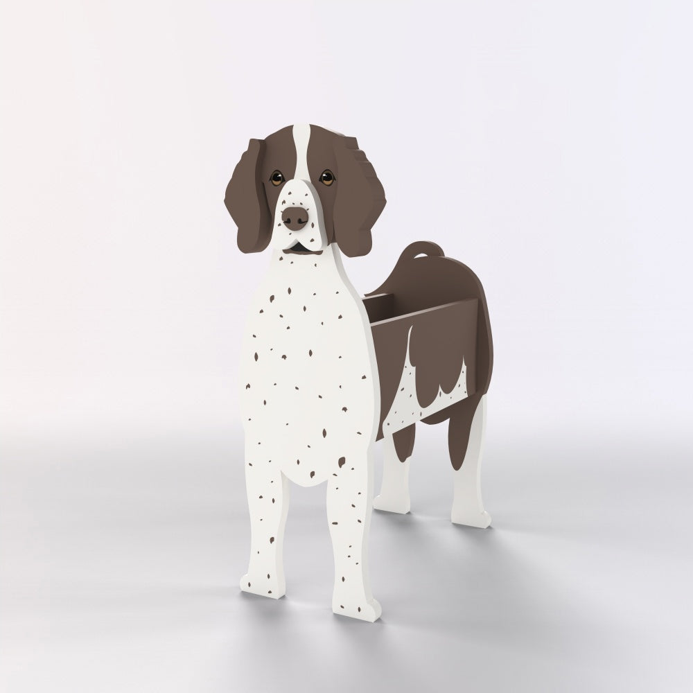 German Shorthaired Pointer dog planter filled with fresh flowers is placed in the garden.