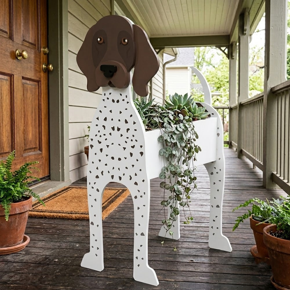 German Shorthaired Pointer dog planter filled with fresh flowers is placed in the garden.
