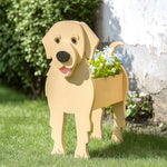 Golden Retriever dog planter filled with fresh flowers is placed in the garden