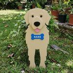 Golden Retriever dog planter filled with fresh flowers is placed in the garden