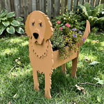 Golden Retriever dog planter filled with fresh flowers is placed in the garden