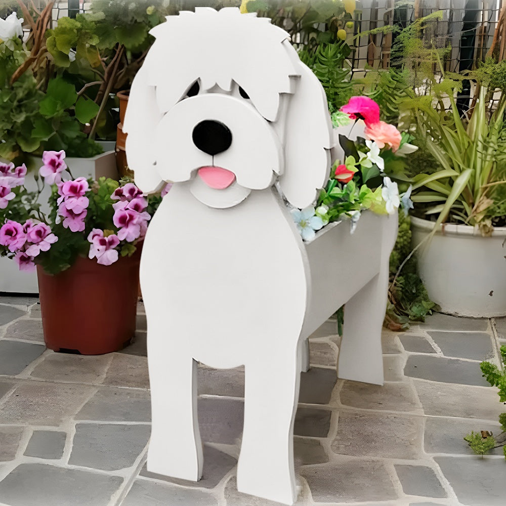 Goldendoodle dog planter filled with fresh flowers is placed in the garden