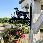 Gordon setter metal hanging basket bracket mounted on outdoor wall for plant decoration