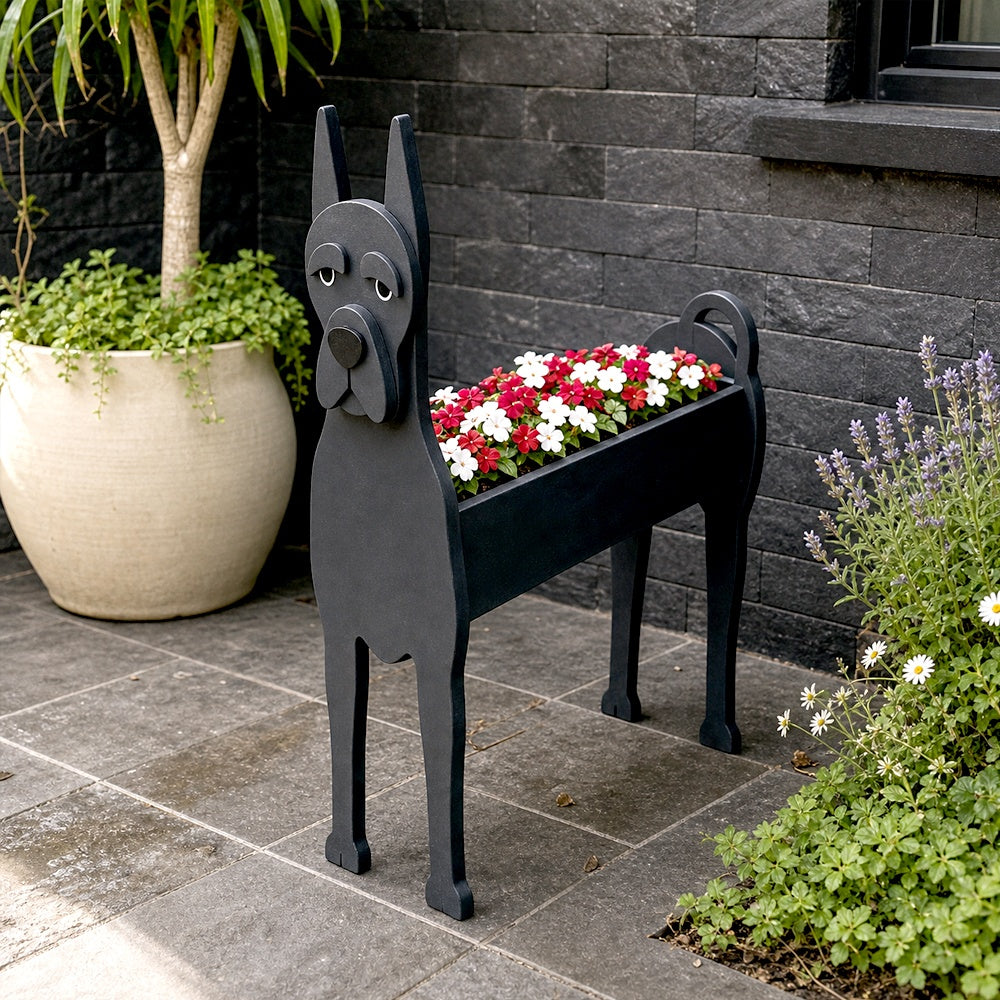 Great Dane dog planter filled with fresh flowers is placed in the garden.