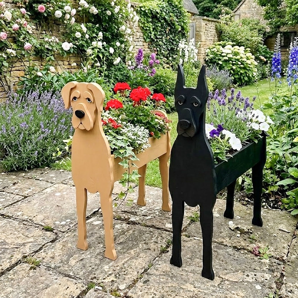 Great Dane dog planters filled with fresh flowers are placed in the garden.