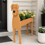 Great Dane dog planter filled with fresh flowers is placed in the garden.