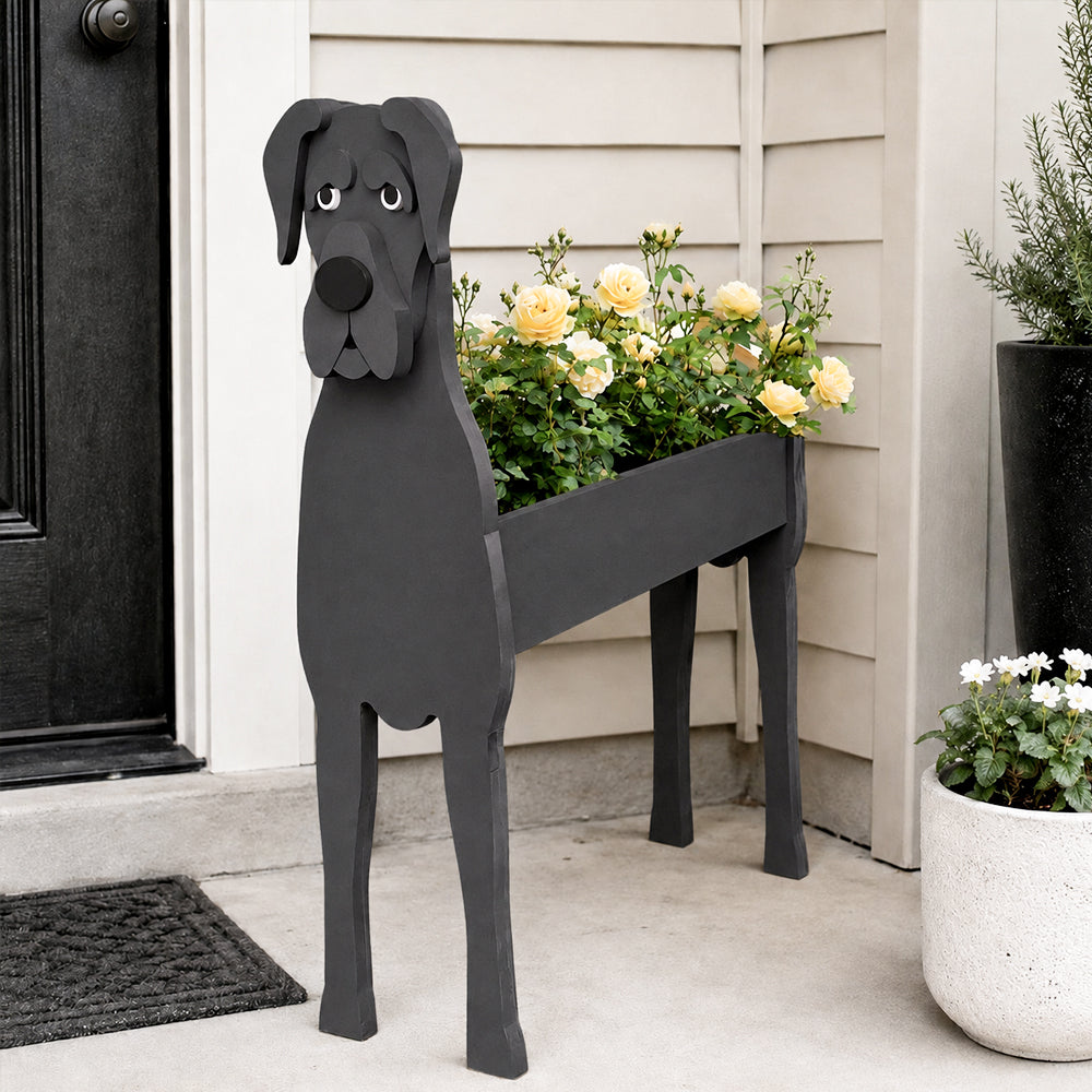 Great Dane dog planter filled with fresh flowers is placed in the garden.