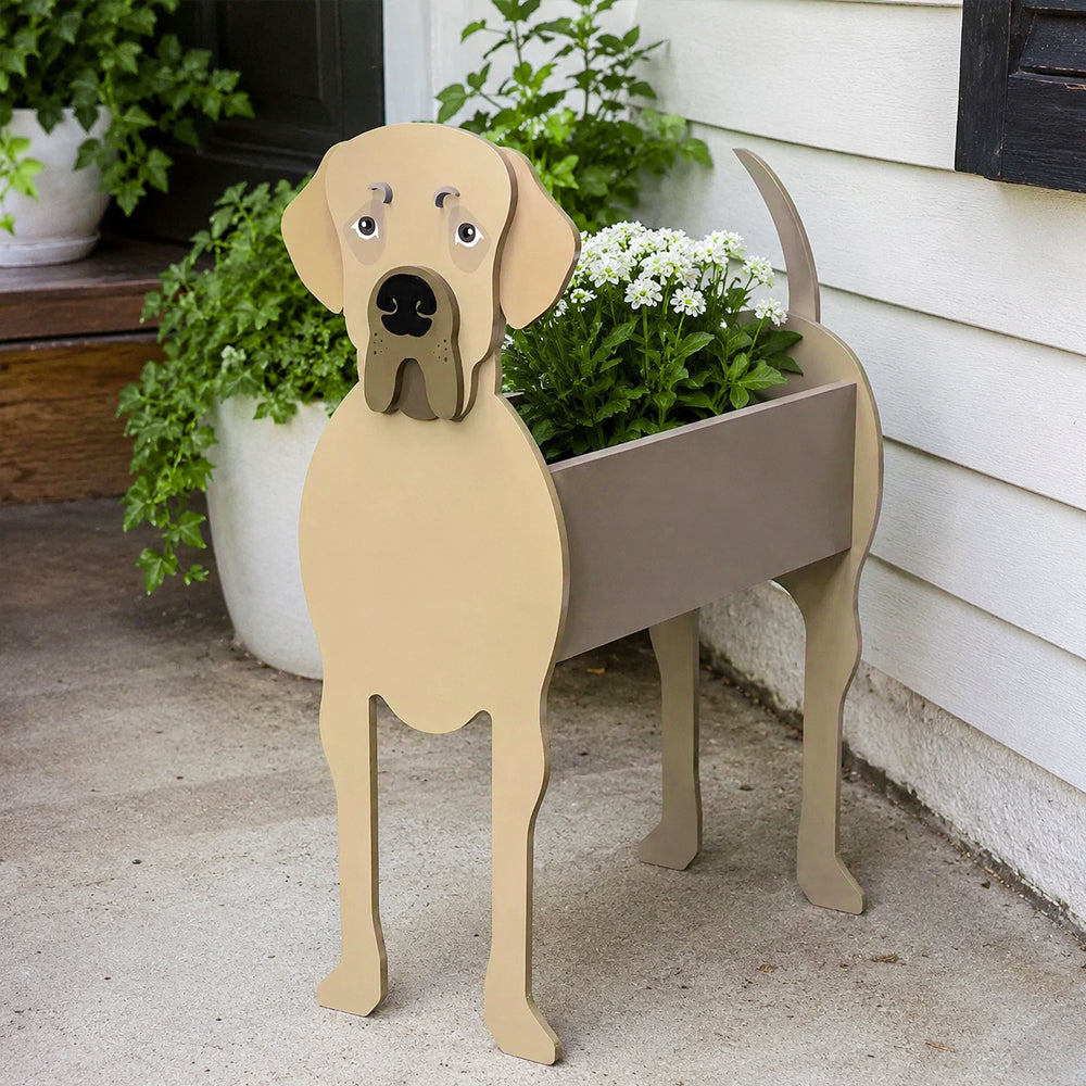 Great Dane dog planter filled with fresh flowers is placed in the garden.
