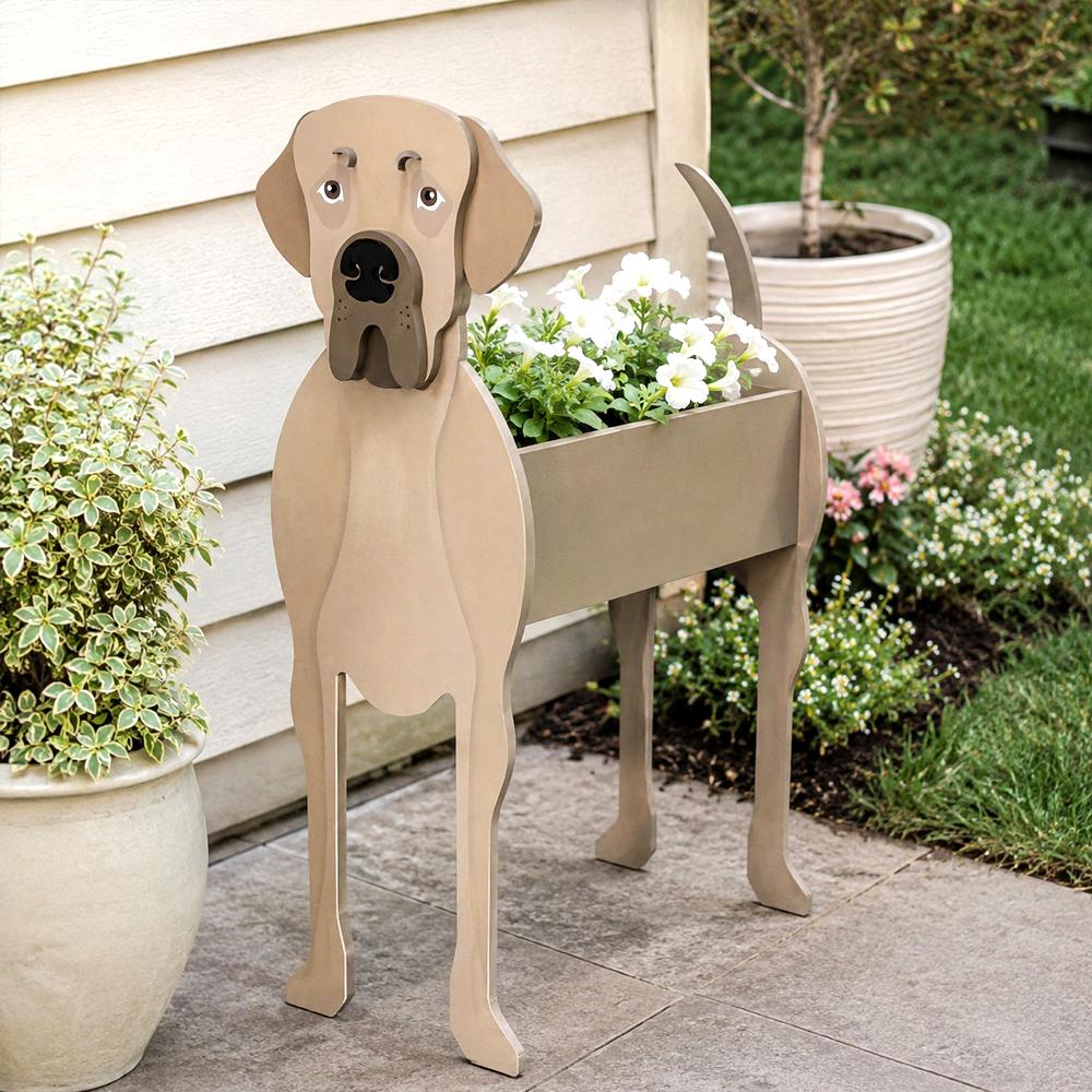 Great Dane dog planter filled with fresh flowers is placed in the garden.