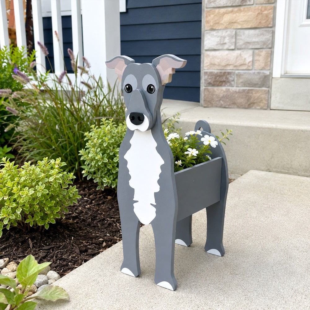 Greyhound dog planter filled with fresh flowers is placed in the garden