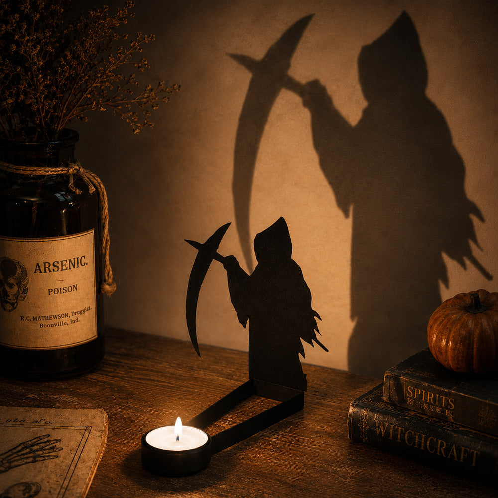 Grim reaper halloween metal candle holder casting a spooky shadow on the wall