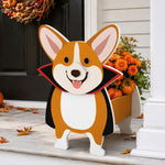 Halloween Corgi dog Planter filled with fresh flowers is placed in the garden