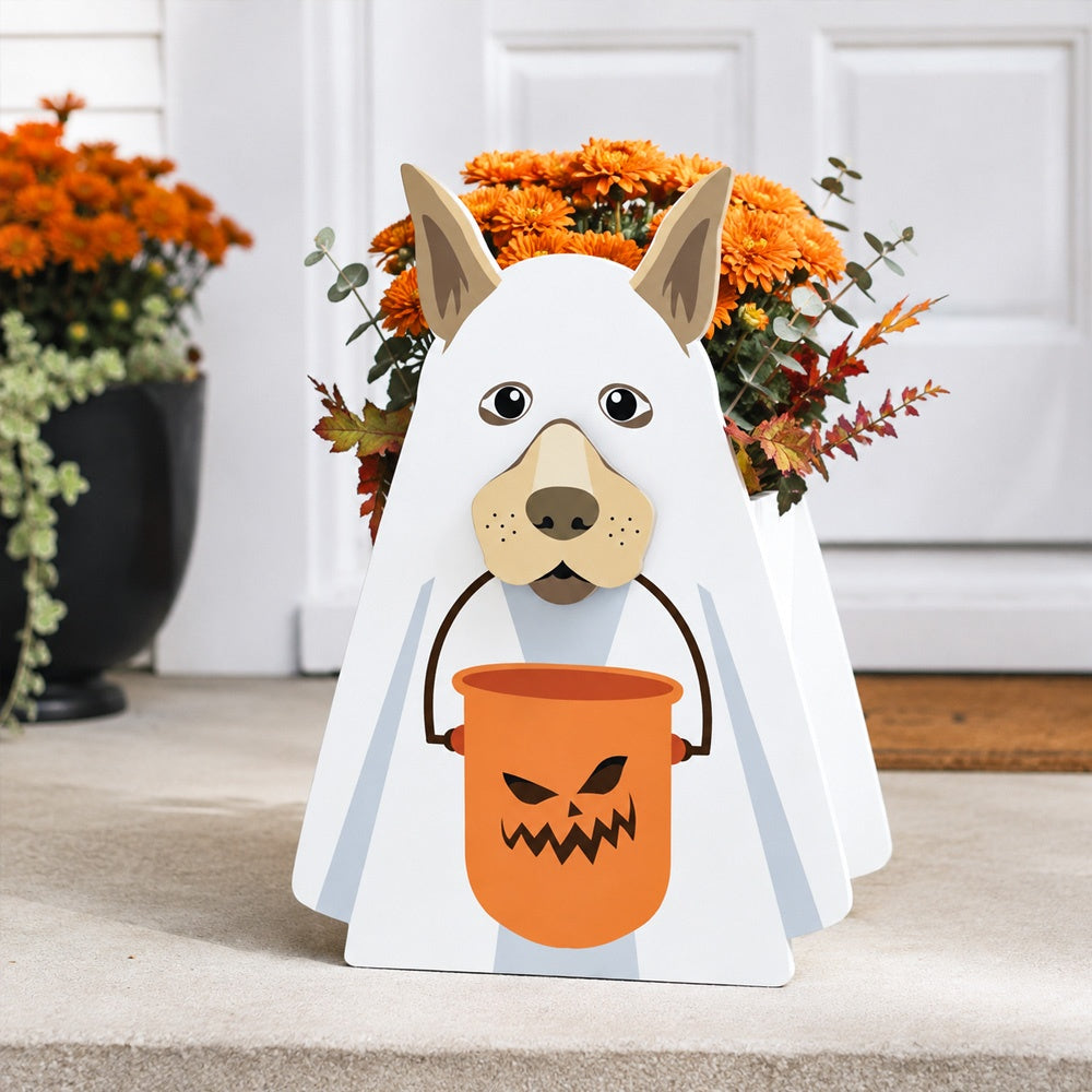 Halloween Ghost Dog Planter filled with fresh flowers is placed in the garden