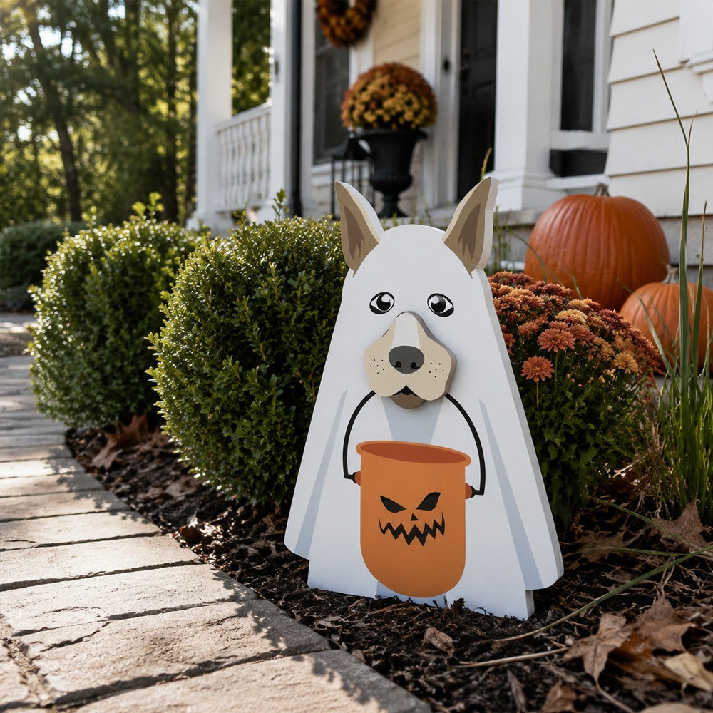 Halloween Ghost Dog Planter filled with fresh flowers is placed in the garden