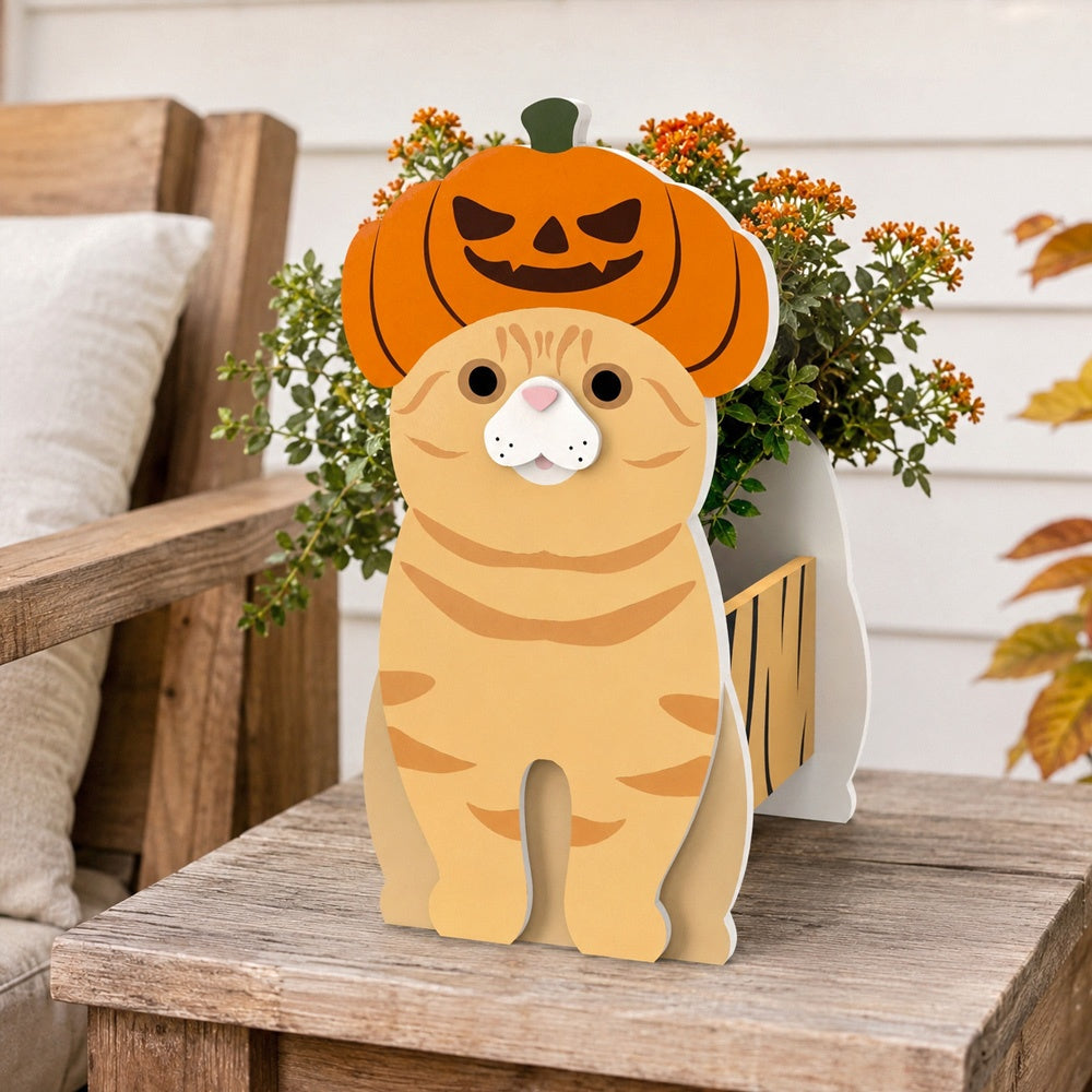 Halloween Orange Cat Planter filled with fresh flowers is placed in the garden
