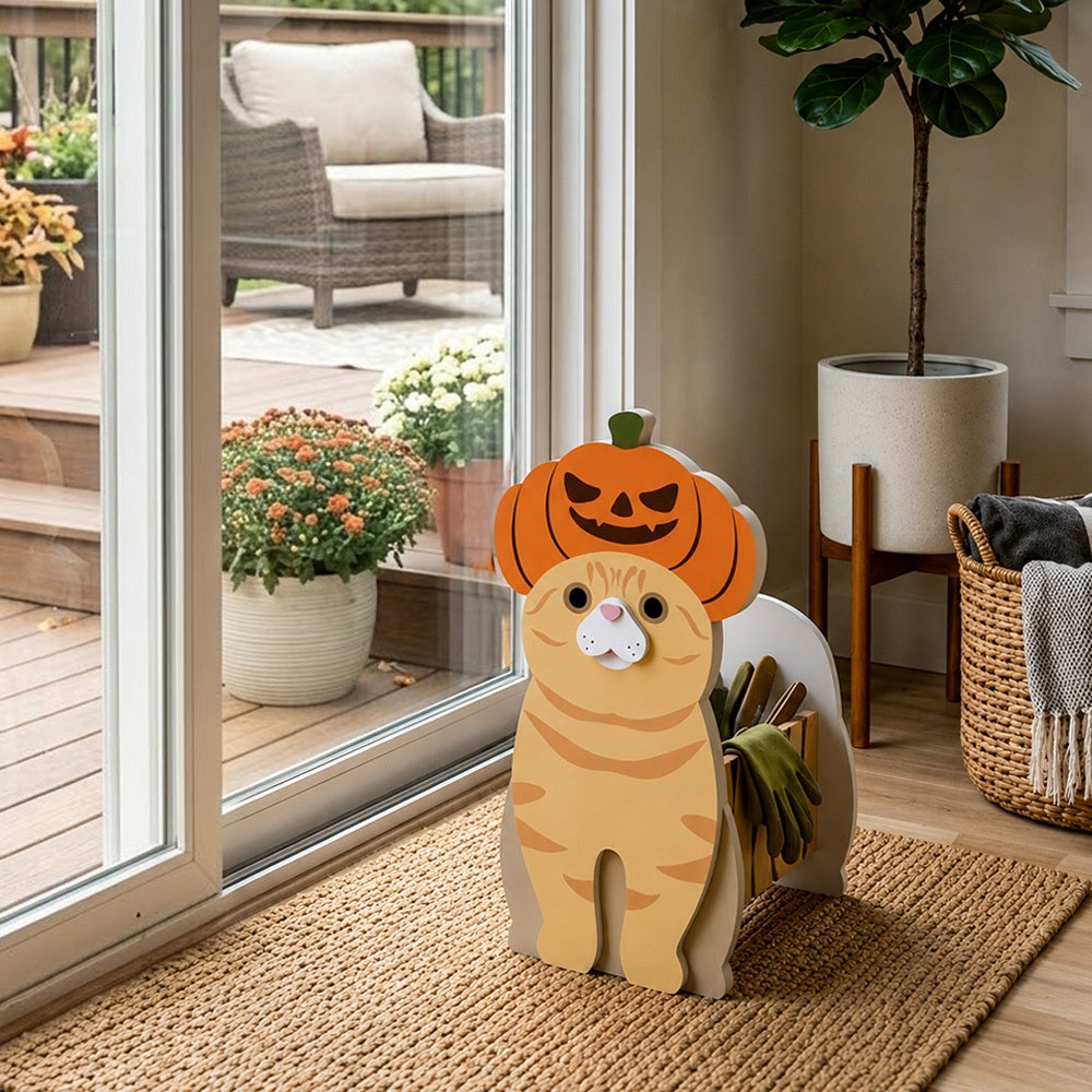 Halloween Orange Cat Planter filled with fresh flowers is placed in the garden
