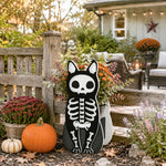 Halloween Skull Cat Planter filled with fresh flowers is placed in the garden