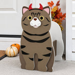 Halloween Tabby Cat Planter filled with fresh flowers is placed in the garden