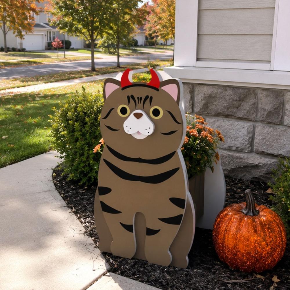 Halloween Tabby Cat Planter filled with fresh flowers is placed in the garden