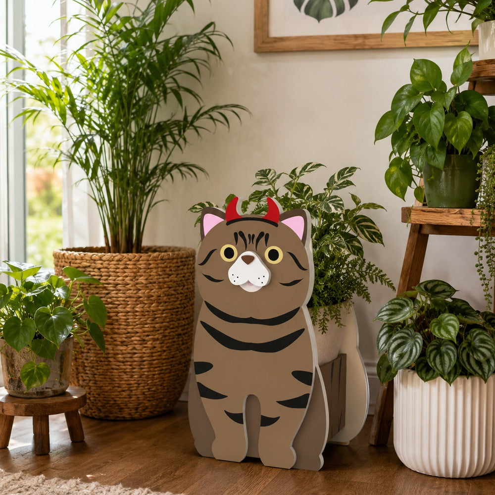 Halloween Tabby Cat Planter filled with fresh flowers is placed in the garden