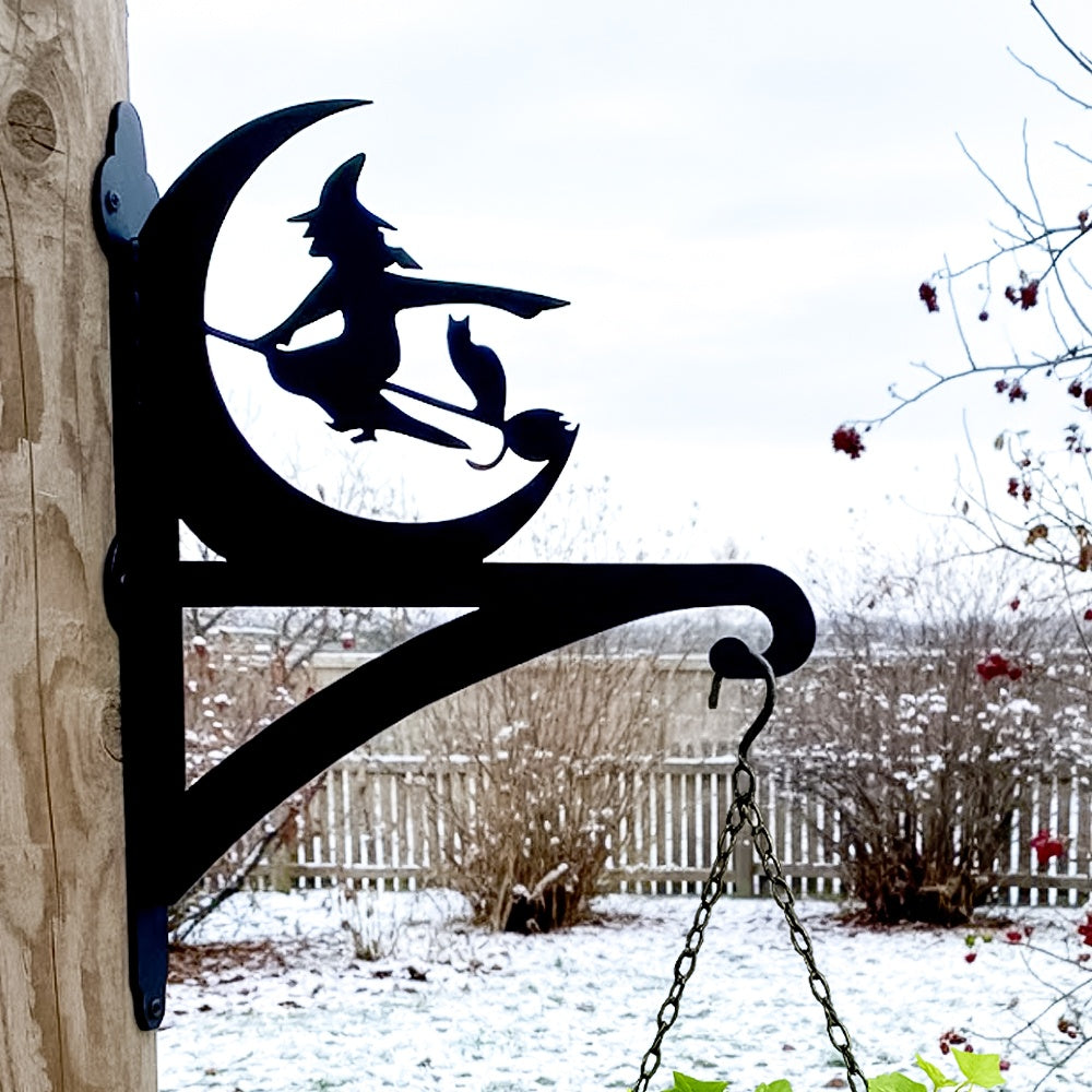 Halloween witch flying on broom metal hanging basket bracket mounted on outdoor wall for plant decoration