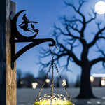 Halloween witch flying on broom metal hanging basket bracket mounted on outdoor wall for plant decoration