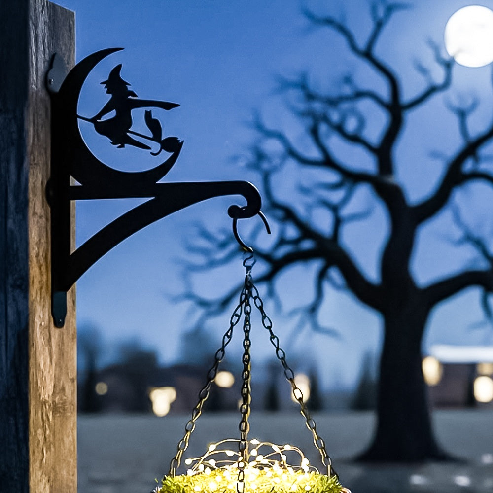 Halloween witch flying on broom metal hanging basket bracket mounted on outdoor wall for plant decoration