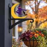 Halloween witch flying on broom metal hanging basket bracket mounted on outdoor wall for plant decoration