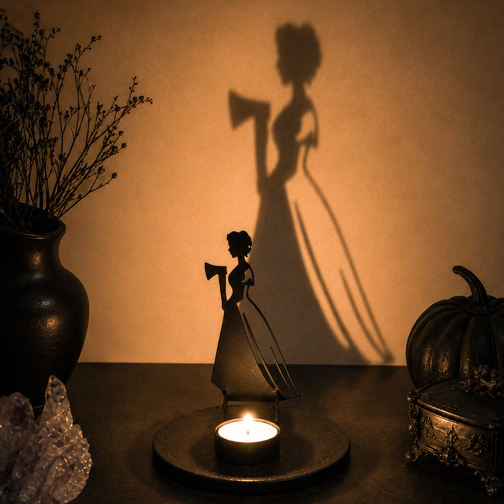 Haunted girl halloween metal candle holder casting a spooky shadow on the wall