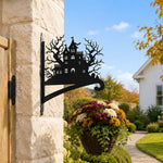 Haunted house metal hanging basket bracket mounted on outdoor wall for plant decoration