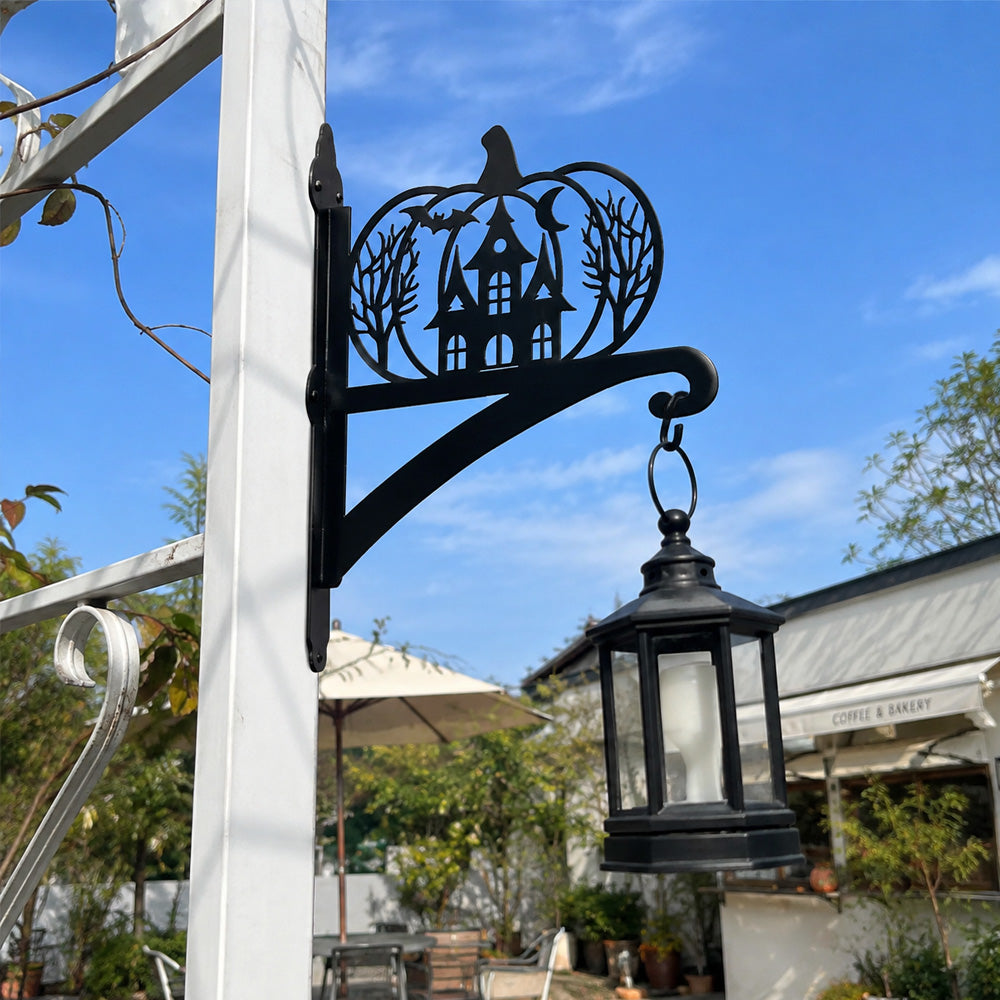 Haunted pumpkin castle metal hanging basket bracket mounted on outdoor wall for plant decoration