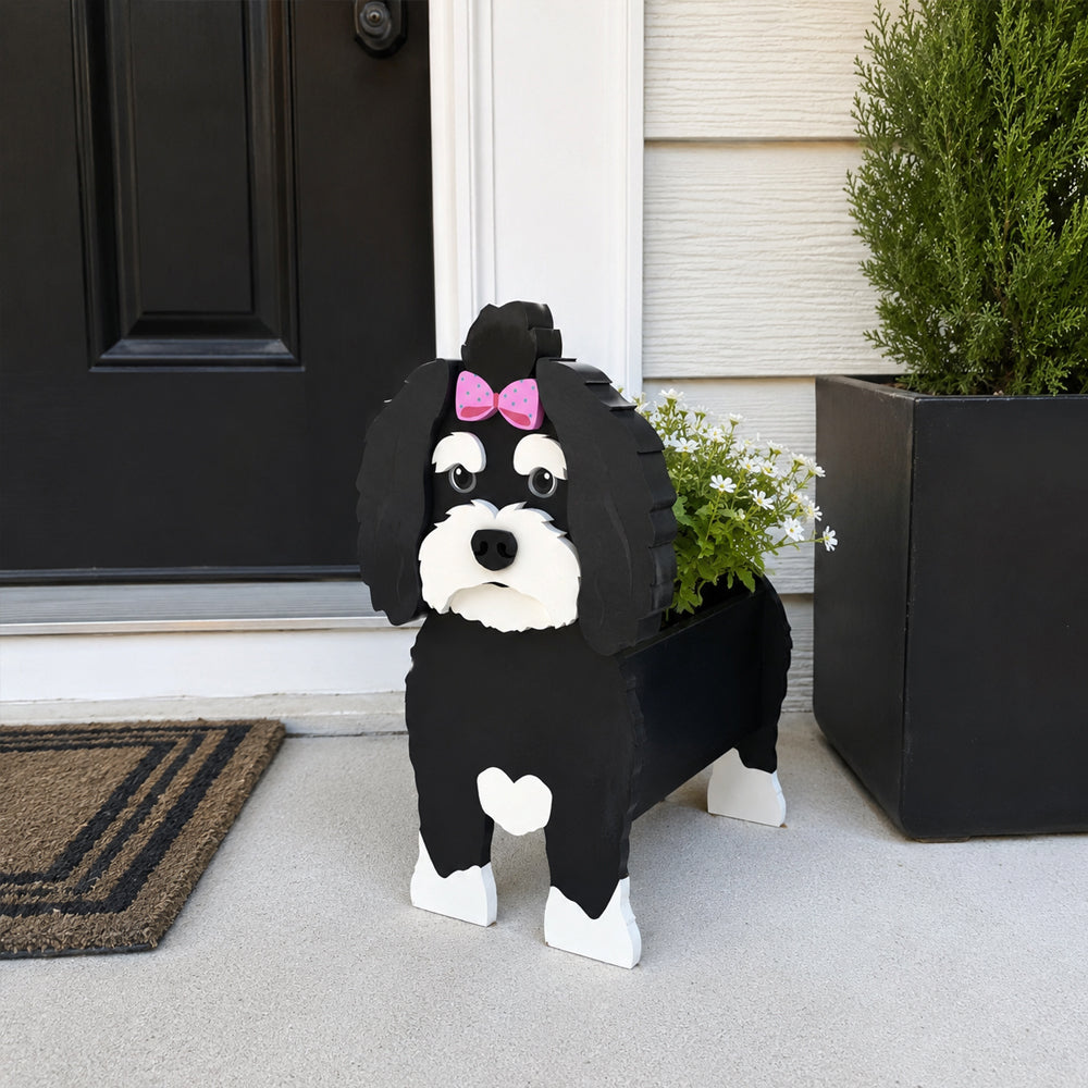 Havanese dog planter filled with fresh flowers is placed in the garden