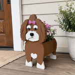 Havanese dog planter filled with fresh flowers is placed in the garden